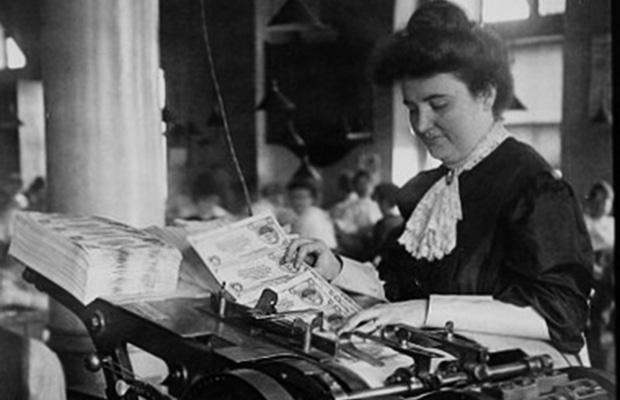 Woman operating machinery at the Bureau of Engraving and Printing